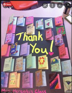 a thank you sign made out of colorful cards