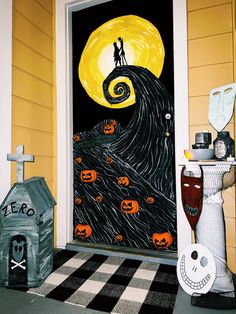 a door decorated with halloween decorations and pumpkins