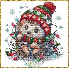 a cross stitch pattern of a hedge in a christmas hat