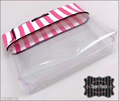 a pink and white striped bag sitting on top of a table