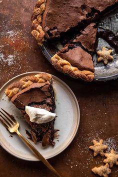 a slice of chocolate pie on a plate with a fork next to it and another half eaten pie in the background