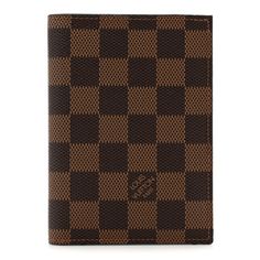 This an authentic LOUIS VUITTON Damier Ebene Passport Cover.  This passport case is crafted of brown classic checkerboard coated canvas in brown. The cover opens to a brown cross-grained leather interior with card slots, patch pockets, and a pocket for your passport. Louis Vuitton Travel, Passport Case, Toiletry Pouch, Louis Vuitton Wallet, Louis Vuitton Damier Ebene, Damier Ebene, Passport Cover, Wallet Bag, Leather Interior