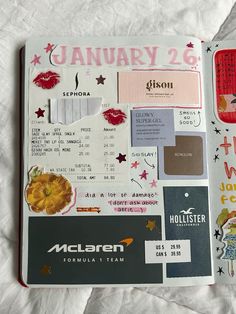 an open planner with various stickers on it