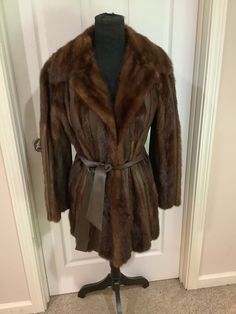 This nice vintage 70s 80s Pelta Furs brown mink leather trim huge collar Fur Coat belted jacket comes to you in a size M. As you can see from the pictures the jacket has a huge fur collar beautiful only worn a couple of times- There is one spot where the fur has come off seam on back- can glue or fix- but when my mom tried on for me could not see it. But I tried to position it so you could see it. Inside fully lined. Boho Belts, Belted Jacket, Belted Coat, Fur Collar, Fur Collars, Leather Trim, Vintage 70s, Leather Trims, Fur Coat