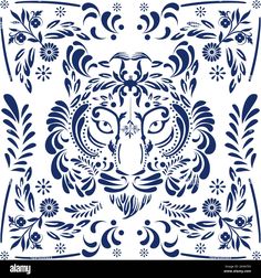 a blue and white ornamental design with an animal's face in the center