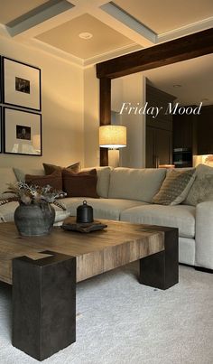 a living room filled with furniture and a coffee table in front of a couch on top of a carpeted floor