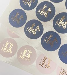 some blue and pink stickers with gold foil on them that say team boss, team boss