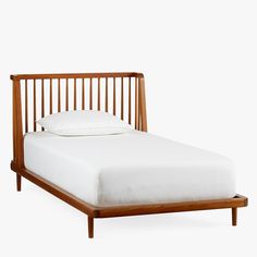 a wooden bed frame with white sheets and pillows on it, against a white background