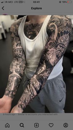 a man with many tattoos on his arm