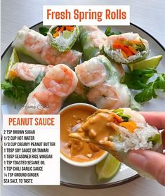 a plate with shrimp and rice rolls on it