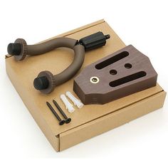 an image of a tool set up in a cardboard box on a white background with clippings