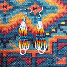 New, Hand Made By Me. White Seed Bead Triple Layered Native American Earrings. Made With Size 11/0 Czech Seed Beads And Blue Crackle Beads, On A Hypoallergenic Wire. Delica Beaded Earrings Native, Beaded Earrings Patterns Native American, Native American Seed Bead Earrings, Southwestern White Dangle Jewelry, Southwestern Style White Dangle Jewelry, White Southwestern Beaded Earrings For Festivals, Southwestern White Beaded Earrings For Festival, White Southwestern Style Beaded Earrings For Festival, White Southwestern Beaded Earrings