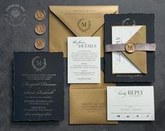 the wedding stationery is laid out on top of each other, including two envelopes