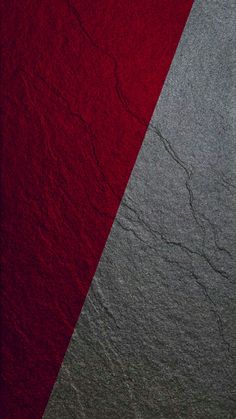 a red and gray wall with two diagonal stripes