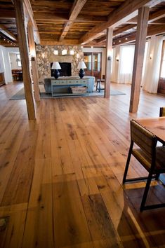 a living room filled with furniture and wooden floors