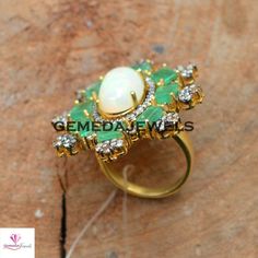 Sale! Genuine Opal Gemstone Ring, Pave Diamond Jewelry, Emerald Gemstone Ring, 925 Silver Gold Vermeil Jewelry, Beautiful Ring, Gift For her Gross Weight: 13.29 gram Gemstone Weight: 10.51 cts Diamond Weight: 1.30 cts Ring Size: 38X33 MM NOTE:- All The Products Are Designed And Manufactured In My Workshop By Me & My Team. Shown Products Are Purely Handmade. Custom Orders Are Open Handly Accepted. We Are the Perfect Choice For Any Custom Jewelry Manufacturing. For Bulk Orders Please Message m White Gemstone Rings For May Birthstone, Anniversary White Stone Rings, White May Birthstone Fine Jewelry Ring, White Rings With Stone Setting In Fine Jewelry Style, White Oval Ring With Stones, White Fine Jewelry Rings With Stone Setting, White Oval Rings With Stones, White Rings With Stone Setting - Fine Jewelry, Opal Wedding Ring With Stone Setting