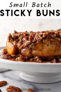 small batch sticky buns on a white plate with pecans