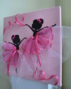 a pink canvas with two ballerinas painted on it