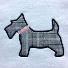 a small gray dog with a pink ribbon on it's collar is embroidered onto a white shirt