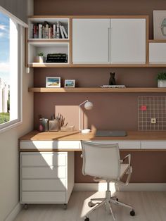 a computer desk sitting under a window next to a white chair and bookshelf