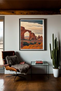 a living room filled with furniture and a painting hanging on the wall next to a window