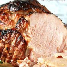 sliced ham sitting on top of a cutting board