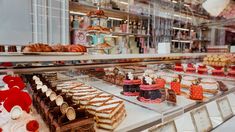 a display case filled with lots of different types of desserts