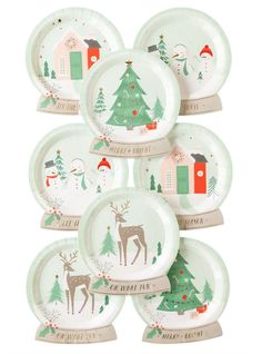 a stack of christmas plates with trees on them