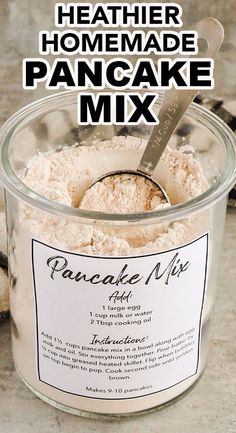 homemade pancake mix in a glass container with a spoon inside and text overlay that reads, healthier homemade pancake mix