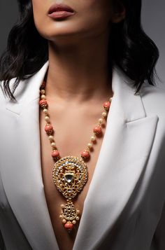 Discover elegance and sophistication with our Coral Stones & Pearls Harmony Necklace. This meticulously crafted piece is designed to elevate your style, offering a timeless beauty that complements any ensemble with grace and charm. Finish: Gold Finish Material: Brass, Corals, Pearls Color: Gold, White, Orange, Coral Size: One Size Closure Type: Box Lock Box Contains: 1 Necklace Coral Jewellery Indian Gold, Luxury Jeweled Necklaces For Celebration, Luxury Long Pearl Necklace For Wedding, Luxury Pendant Necklaces For Celebration, Elegant Kundan Necklace With Pearl Pendant For Formal Events, Elegant Kundan Necklace With Pearl Pendant For Formal Occasions, Luxury Necklaces With Jewels For Festive Occasions, Luxury Jeweled Necklaces For Festive Occasions, Luxury Festive Necklaces With Jewels