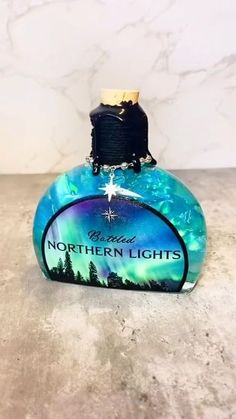 a bottle of northern lights cologne sitting on top of a counter