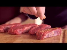 a person cutting up meat with a knife