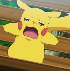 a pikachu with its mouth open and hands in the air