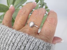 Sterling White Buffalo Turquoise Ring. Southwestern 925 sterling silver ring with a pretty white buffalo turquoise stone. Native design,dainty with a face height of 9mm. Nice Native roping around the bezel of the pretty teardrop shape stone. Various sizes in the dropdown. Stamped 925. Please note that being a natural stone, each may vary. All are very pretty. White Buffalo Stone White Buffalo--also known as White Buffalo Turquoise--is a gemstone that is mined in Tonopah, Nevada. It was presumed White Buffalo Ring, Tonopah Nevada, White Buffalo Turquoise, Native American Rings, Native Design, Palm Beach Fl, 925 Ring, White Turquoise, White Buffalo