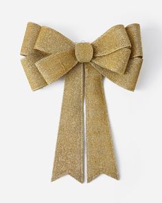 a gold bow on a white background