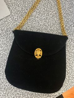 "Vintage Prestige evening bag Black  Gold tone embellished clasp Gold tone chain Includes a mirror and comb inside Zipper pocket Adjustable strap, can double the chain - extends to a drop of 12\" Approx 6\" tall x 5.5\" across" Classic Formal Bags With Chain Detail, Elegant Bags With Gold Chain, Elegant Bags With Gold Chain For Fashion, Elegant Bags With Gold Chain As Fashion Accessory, Luxury Evening Bags With Gold Chain, Formal Clutch Shoulder Bag With Chain Detail, Formal Clutch Shoulder Bag With Chain, Classic Formal Shoulder Bag With Chain, Formal Rectangular Shoulder Bag With Chain