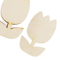 three pieces of wood cut out to look like tulips