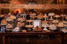 a table filled with lots of pies and pastries