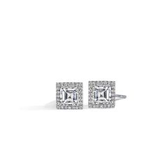 This pair of diamond studs has been carefully matched in size. I/J color and VVS clarity ensures that these near colorless diamonds are free from any visible inclusions to the unassisted eye. These center diamonds weigh 1.050 carats total weight and 1.04 carats total weight each for a total combined of 2.09 carats and are surrounded by an additional 0.31 carats total weight of diamonds. J.R. Dunn has a lifetime 100% trade up policy. Trade in value must be 25% higher than original purchase. If yo Florida Jewelry, Weight Set, Colorless Diamond, Step Cut, Diamond Halo, South Florida, Diamond Studs, Halo Diamond, Round Diamonds