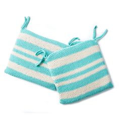 two blue and white striped dishcloths with ties on them, one in the shape of a square