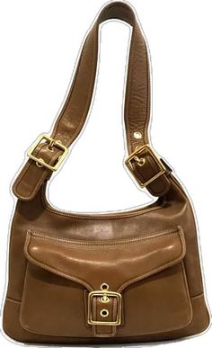 Elegant Brown Saddle Bag With Brass Hardware, Classic Gold Hobo Bag With Gold-tone Hardware, Classic Brown Crossbody Hobo Bag, Coach Leather Hobo Bag With Gold-tone Hardware, Coach Shoulder Bag With Brass Hardware, Classic Coach Shoulder Bag With Brass Hardware, Gold Leather Baguette Bag For Travel, Classic Coach Bags With Brass Hardware, Elegant Rectangular Hobo Bag With Brass Hardware