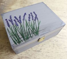 a painted box with lavender flowers on it