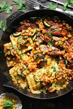 a skillet filled with zucchini and corn