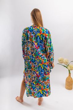 This beautiful tunic with the colorful embroidery is flashy, fun, and extremely comfortable. The dress is made of Egyptian cotton which is widely renowned for its quality and texture. The dress is extremely light and soft and can be used on many occasions - beach, lounge, resort, festivals, theme parties, or just in your home to feel comfortable, fresh and chic. Size : Free sized dress. This tunic is a free sized dress meaning that it comes in one size only that fits any size from a small up to Multicolor Summer Shirt Dress For Beach, Casual Multicolor Shirt Dress For Beach, Casual Multicolor Shirt Dress For The Beach, Multicolor Printed Midi Dress For Vacation, Printed V-neck Shirt Dress For Vacation, Vacation V-neck Printed Shirt Dress, Patterned Midi Dress With Vibrant Print For Vacation, Multicolor Printed Midi Dress For Beach, Patterned Vibrant Print Midi Dress For Beach