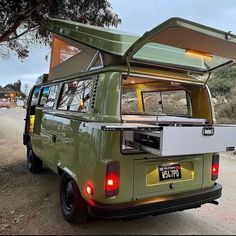 an old vw bus with its roof open