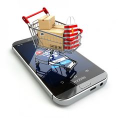 a cell phone with a shopping cart on top of it