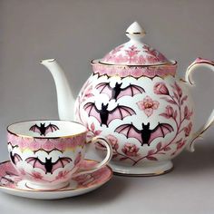 a tea set with bat designs on it