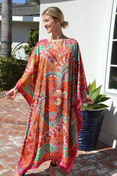 "This beautiful silk caftan is a design from Hermes called \"le Jardin de la Maharani Recadre\". It was designed as a tribute to Maharani of Jaipur who devoted her life to the support of the women of India. It is an intricate, mixed design with colors of orange, reds, green and pinks, with a pink border outlining it all. The generous amount of silk fabric adds to its elegance and beautiful flow. Appropriate for so many occasions. One size. It fits many sizes from small to X-Large. The width, edg Long Silk Dress, Silk Caftan, Beach Caftan, Pink Border, Silk Kaftan, Silk Dress Long, Tent Dress, Dress Silk, Casual Elegance