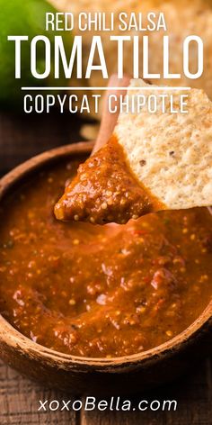 red chili salsa with tortilla chips in a wooden bowl and text overlay