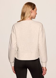 Our In The Studio Cropped Pullover combines a classic crewneck design and super soft, trendy scuba fabric for a lightweight pullover you can take from studio to street. A slightly cropped length is complemented by a relaxed fit, dropped shoulders and sporty seaming detail that allow for easy styling and layering. Throw this cute crop sweatshirt over a sports bra for a workout or pair it with jeans for a casual-cute look. Versatile Crew Neck Tops With Ribbed Cuffs, Relaxed Fit Cropped Sweater For Layering, Crew Neck Relaxed Fit Cropped Sweater In Athleisure Style, Oversized Sporty Cropped Sweater With Crew Neck, Athleisure Relaxed Fit Crew Neck Cropped Sweater, Sporty Oversized Cropped Sweater With Crew Neck, Sporty Crew Neck Sweatshirt For Layering, Sporty Tops With Ribbed Waistband For Layering, Versatile Crew Neck Sweatshirt For Layering